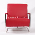 Elegante sillón de cuero moderno con marco de acero inoxidable